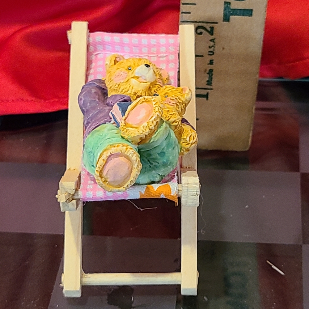 Cutie pie bear sitting in beach chair wood chair